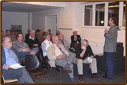 Rudolf Reinhardt sitting in the first row while Prof. Ernst Strouhal (Vienna) giving a lecture (Berlin, October 2005)