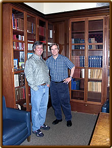 Andy and John in front of the valuable chess books of the Mechanics’ Institute